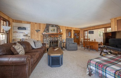 On the shores of beautiful Woman Lake, this home captures the - photo 11