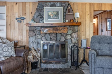On the shores of beautiful Woman Lake, this home captures the - photo 13