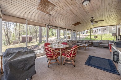 On the shores of beautiful Woman Lake, this home captures the - photo 15