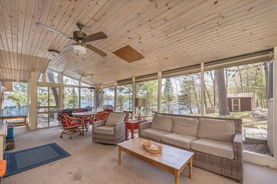 On the shores of beautiful Woman Lake, this home captures the - photo 16
