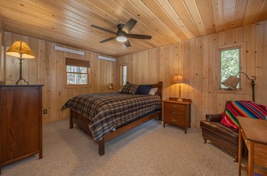 On the shores of beautiful Woman Lake, this home captures the - photo 18