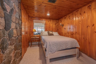On the shores of beautiful Woman Lake, this home captures the - photo 19