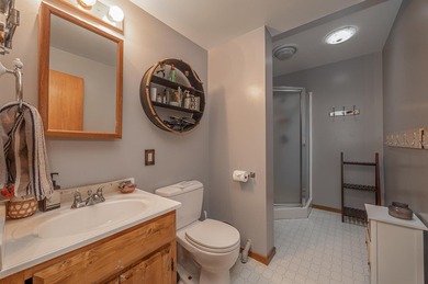 On the shores of beautiful Woman Lake, this home captures the - photo 21