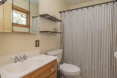 On the shores of beautiful Woman Lake, this home captures the - photo 22
