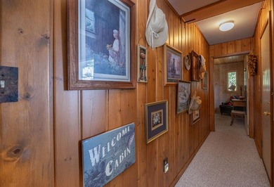 On the shores of beautiful Woman Lake, this home captures the - photo 23