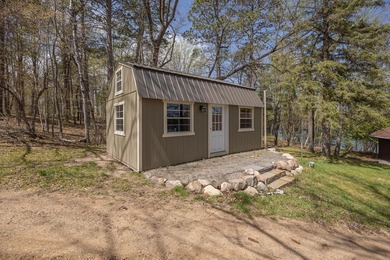 On the shores of beautiful Woman Lake, this home captures the - photo 25