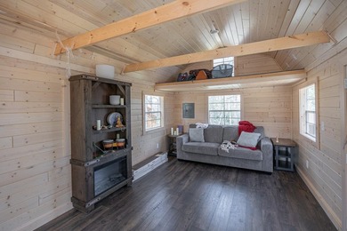 On the shores of beautiful Woman Lake, this home captures the - photo 26