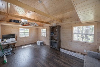 On the shores of beautiful Woman Lake, this home captures the - photo 27