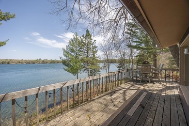 On the shores of beautiful Woman Lake, this home captures the - photo 29