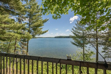 On the shores of beautiful Woman Lake, this home captures the - photo 30