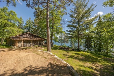 On the shores of beautiful Woman Lake, this home captures the - photo 33