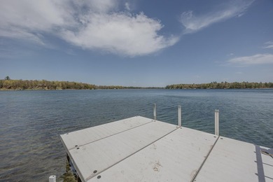 On the shores of beautiful Woman Lake, this home captures the - photo 37