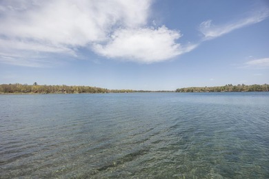 On the shores of beautiful Woman Lake, this home captures the - photo 38