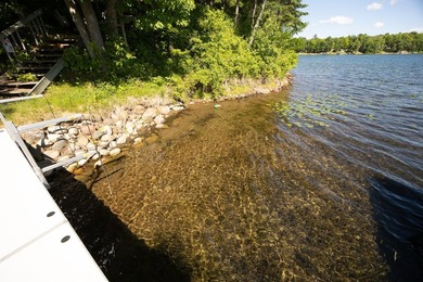 On the shores of beautiful Woman Lake, this home captures the - photo 39