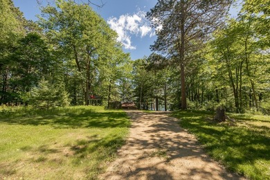 On the shores of beautiful Woman Lake, this home captures the - photo 40