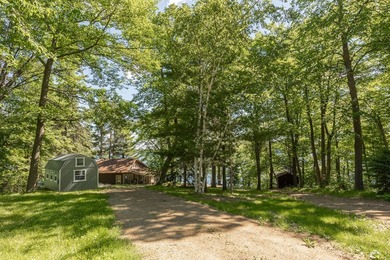 On the shores of beautiful Woman Lake, this home captures the - photo 41