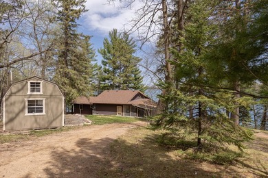 On the shores of beautiful Woman Lake, this home captures the - photo 42