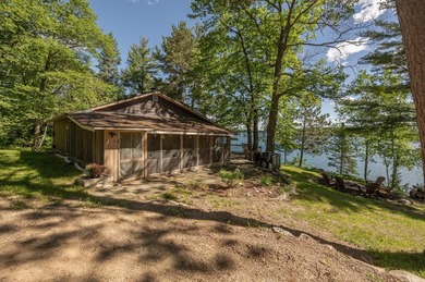 On the shores of beautiful Woman Lake, this home captures the - photo 44