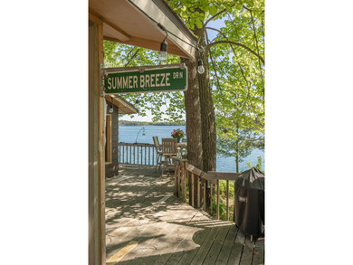 On the shores of beautiful Woman Lake, this home captures the - photo 46