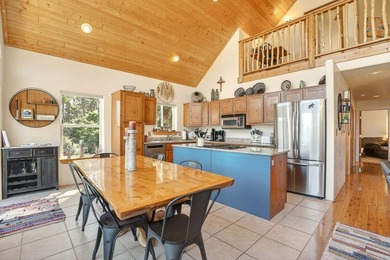 Nestled among the tall pines of Angel Fire, this warm and - photo 11