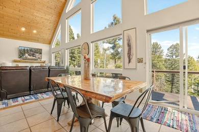 Nestled among the tall pines of Angel Fire, this warm and - photo 12