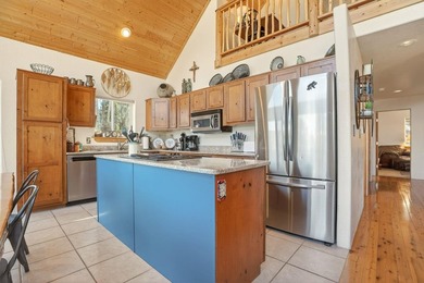 Nestled among the tall pines of Angel Fire, this warm and - photo 14