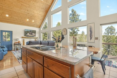 Nestled among the tall pines of Angel Fire, this warm and - photo 16