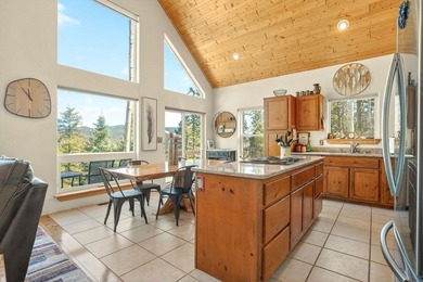 Nestled among the tall pines of Angel Fire, this warm and - photo 18