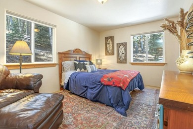Nestled among the tall pines of Angel Fire, this warm and - photo 26