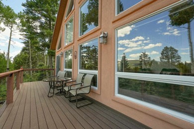 Nestled among the tall pines of Angel Fire, this warm and - photo 46