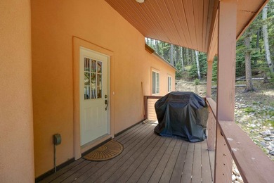 Nestled among the tall pines of Angel Fire, this warm and - photo 49