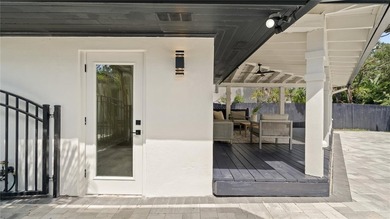 This completely remodeled 5-bedroom, 5-bathroom home sits on a - photo 45