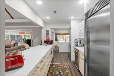 Completely remodeled and designed for luxury living, this - photo 9