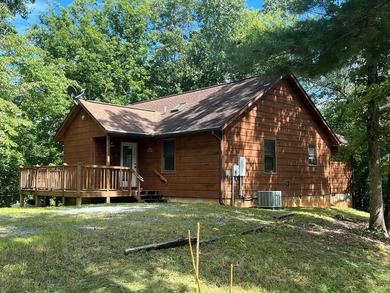 Situated on a tranquil, tree covered lot, this inviting - Lake Home For Sale in Marble, North Carolina