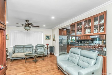 Set on a manicured corner lot in Bayside, this expanded Colonial - photo 12
