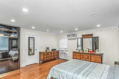 Set on a manicured corner lot in Bayside, this expanded Colonial - photo 16