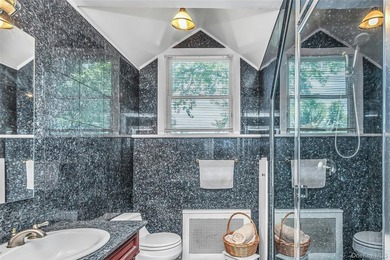 Set on a manicured corner lot in Bayside, this expanded Colonial - photo 17