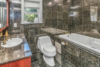 Set on a manicured corner lot in Bayside, this expanded Colonial - photo 22