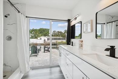 All remodeled with a new open kitchen and large impact sliders - photo 11