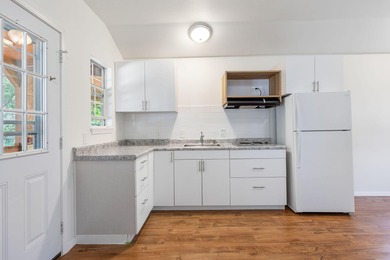 TWO homes for the price of ONE! The main home, custom built in