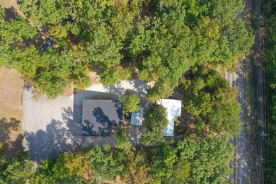 TWO homes for the price of ONE! The main home, custom built in