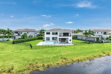 Nestled behind the prestigious gates of Boca Bridges, this - photo 2