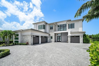 Nestled behind the prestigious gates of Boca Bridges, this - photo 4