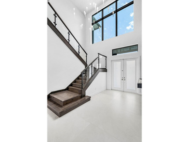 Nestled behind the prestigious gates of Boca Bridges, this - photo 5