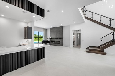 Nestled behind the prestigious gates of Boca Bridges, this - photo 8