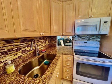 Welcome to this charming two-bedroom, two-bathroom condominium - photo 1