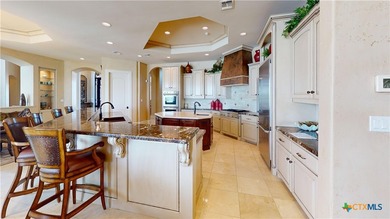 Located on the tranquil shores of the gated community of The - photo 13