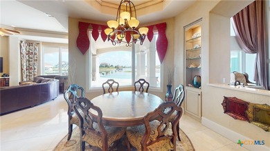 Located on the tranquil shores of the gated community of The - photo 16