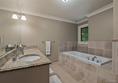 Completely rebuilt in 2008, this European-style Tudor home - photo 24