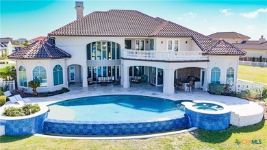 Located on the tranquil shores of the gated community of The - photo 37